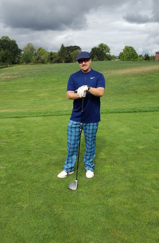 Ken Playing in a Golf Tournament