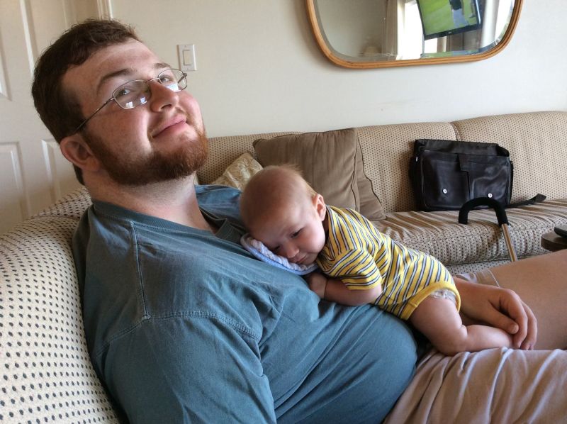 Uncle Tyler With Sleeping Baby Brooks