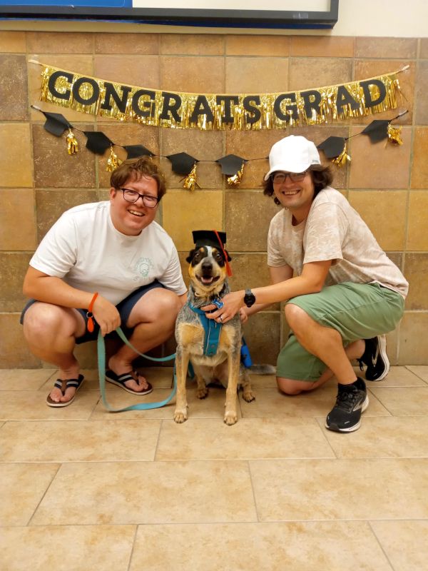 Proud Dog Dads at Ada's Puppy School Graduation
