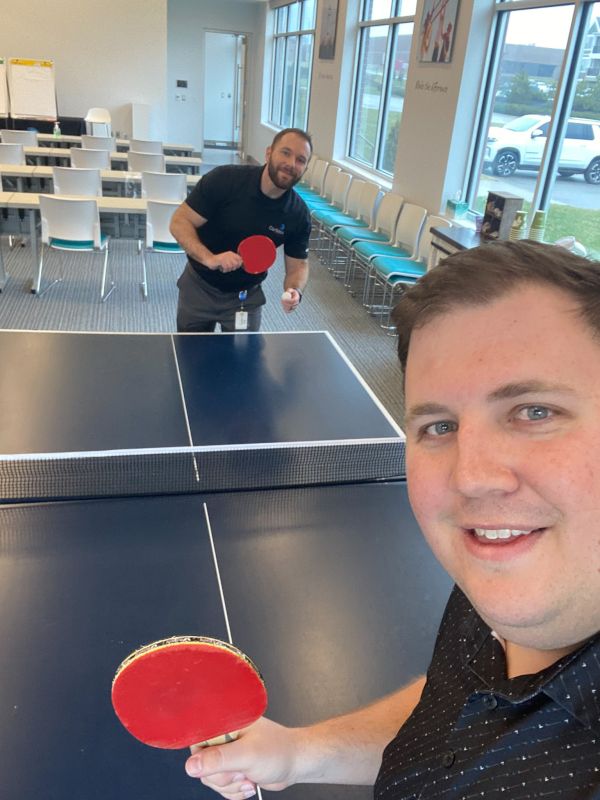 Brad Playing Ping Pong with a Friend