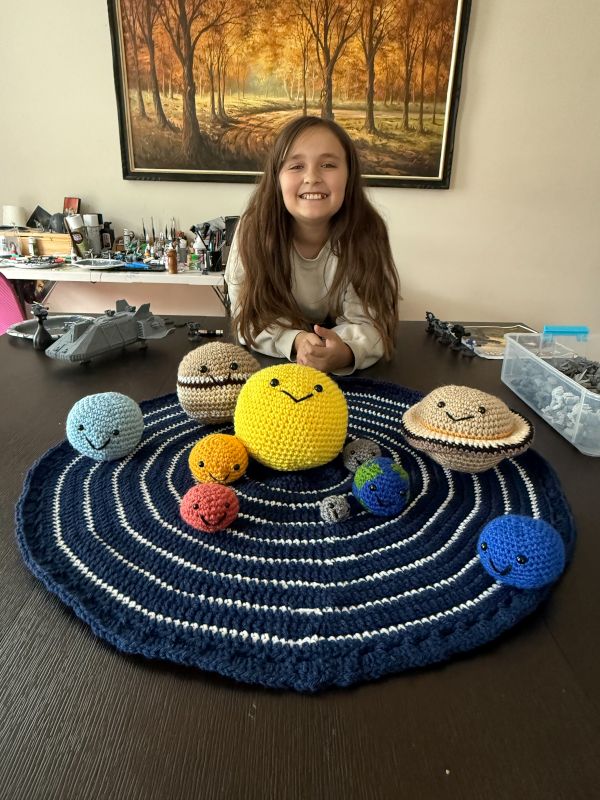 Arya With the Solar System She Crocheted