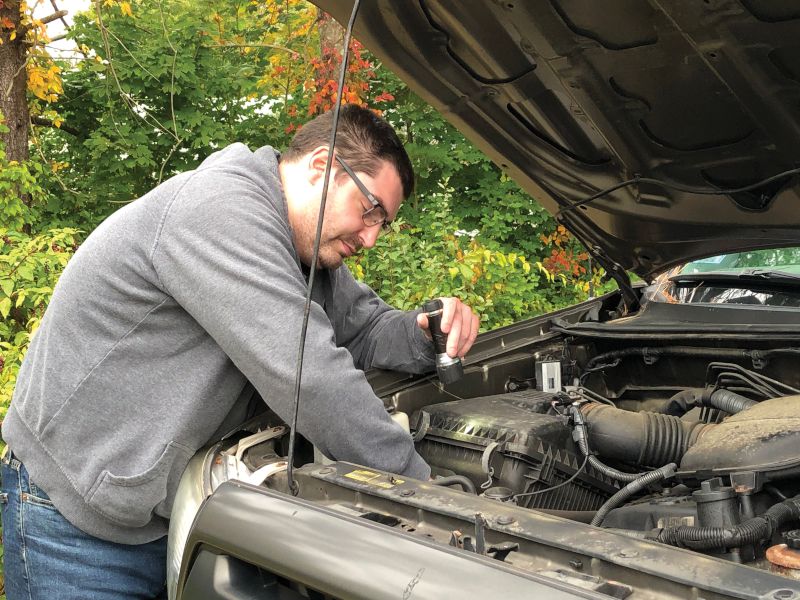 Nathan Working on His Truck